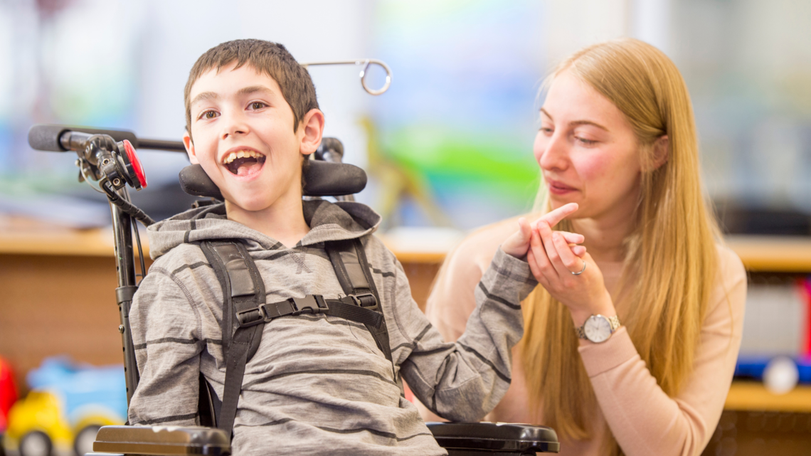 Photo of woman and boy in wheelchair