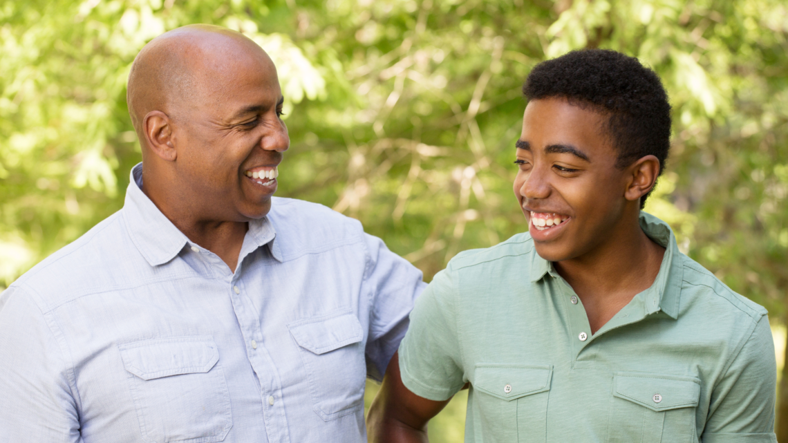 Photo of father and son smiling