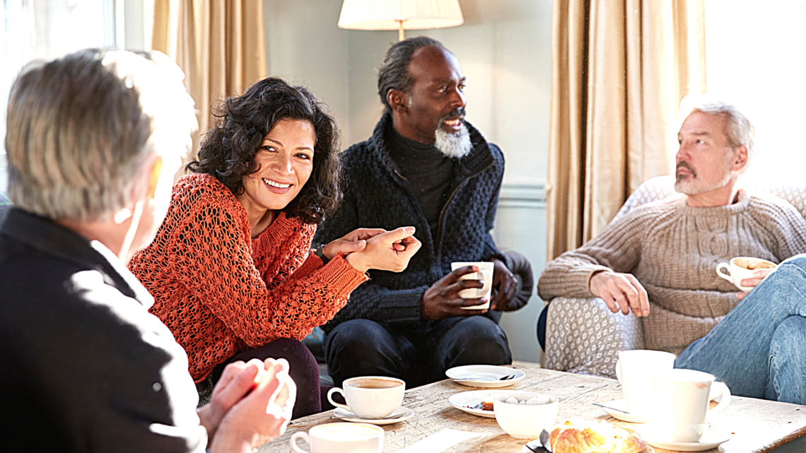 photo of a group of people talking.