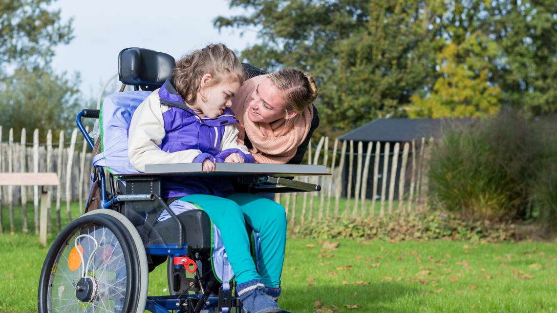 Photo of a Woman and girl in wheelchair
