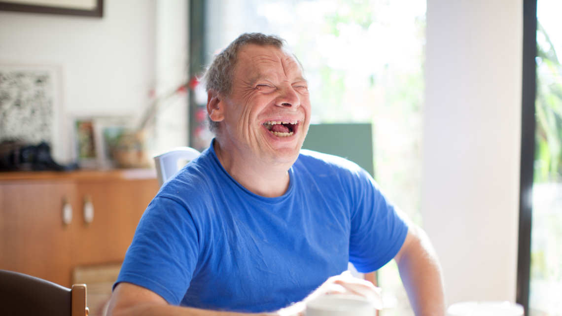 Photo of a man laughing